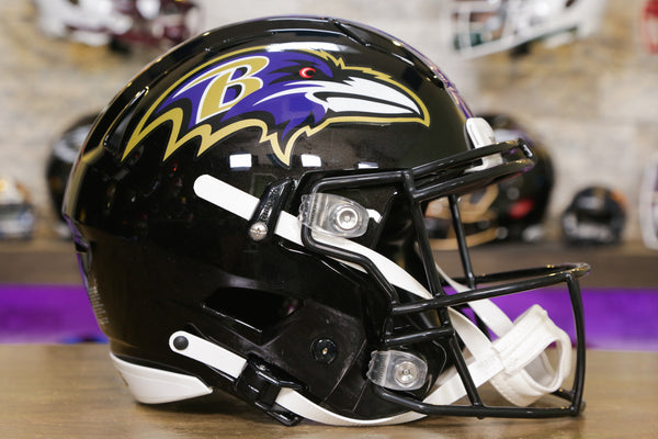 A Baltimore Ravens helmet sits on the field prior to the game